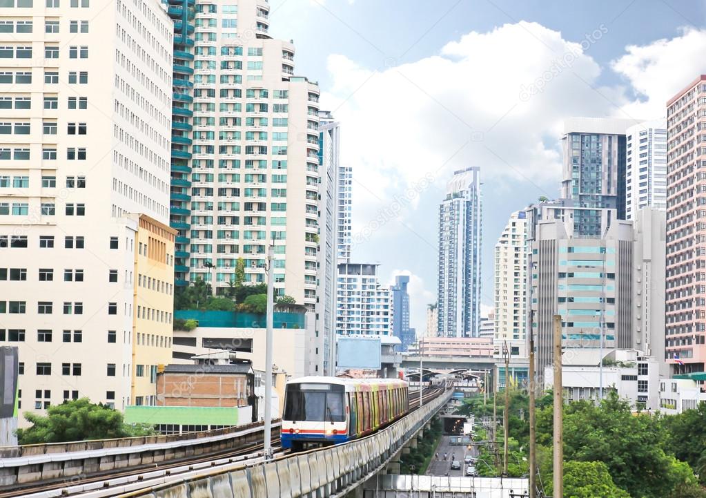 Sky train railway in Bangkok with business building