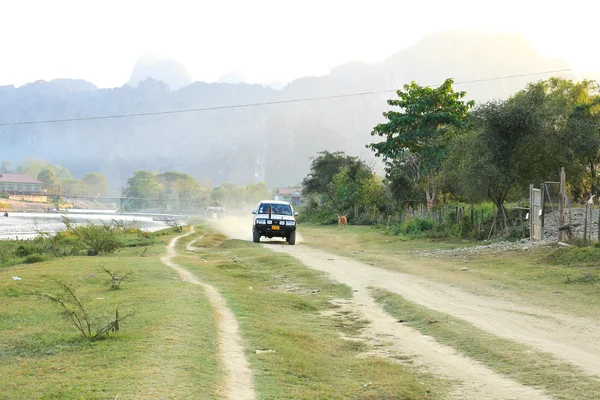 VANG VIENG, LAOS - FEB 1: Local car on a rural road on February — Stock Photo, Image