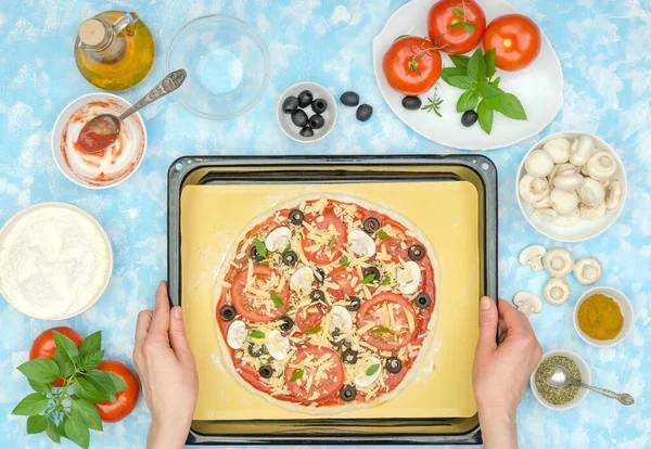 How to make a homemade veggie pizza step by step, step 11 - transfer the pizza to a baking dish