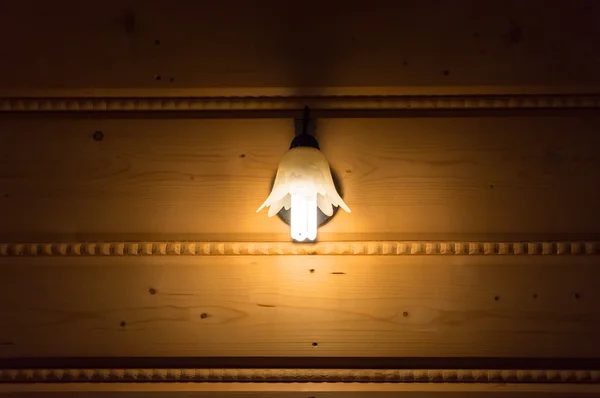 Lamp on the wooden wall — Stock Photo, Image