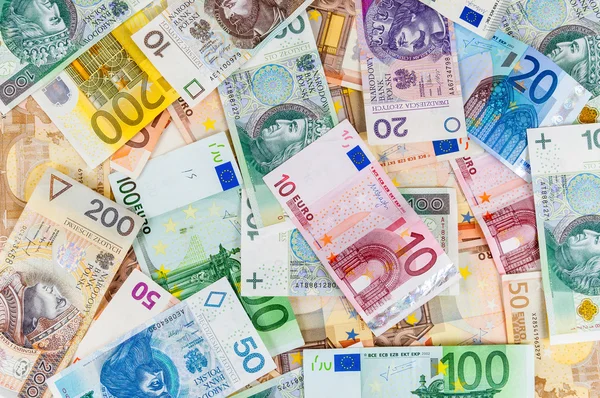 Евро и польский злотый фон — стоковое фото