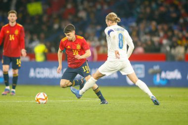 Pedri of Spain in action during a friendly match between Spain and Iceland at Riazor Stadium on March 29, 2022, in La Coruna, Spain.  clipart