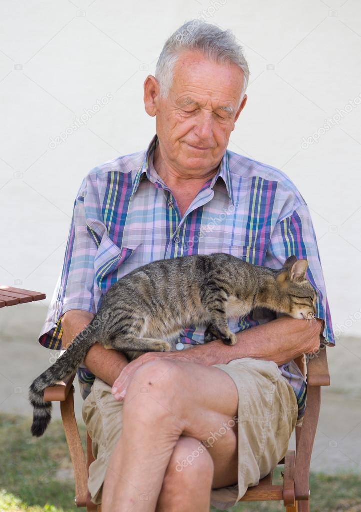 Senior man with cat