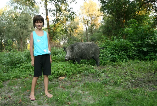 Girl with wild boar — Stock Photo, Image