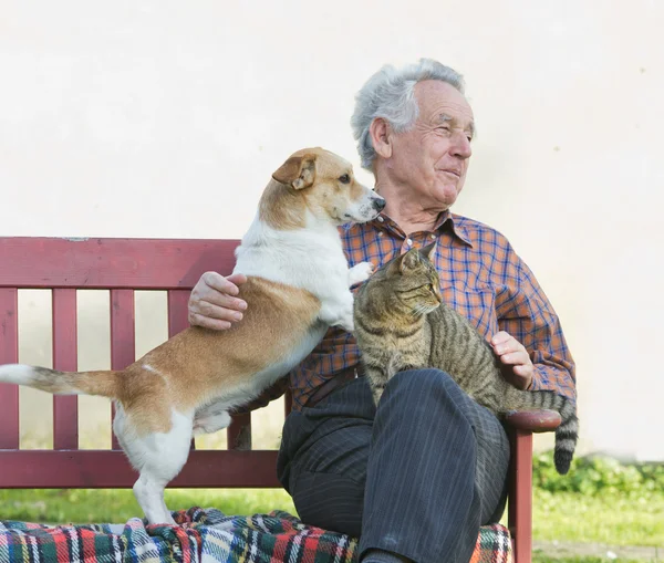 Pensioner with his pets — Stock Photo, Image