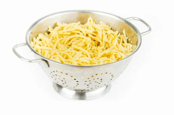 Spaghetti in colander — Stock Photo, Image