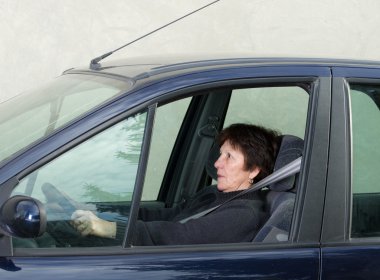 Scared woman in car clipart
