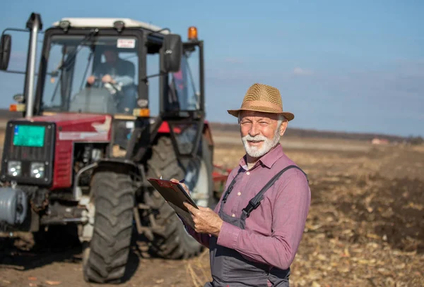 Happy Mature Farmer Taking Notes Organic Farm Looking Camera While — Stockfoto