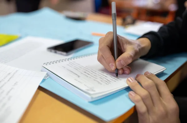 Close Student Hand Writing Notes Notebook Desk Classroom — Stock Photo, Image