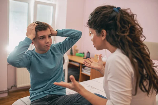 Angry Mother Having Serious Talk Son His Room While Boy — стоковое фото