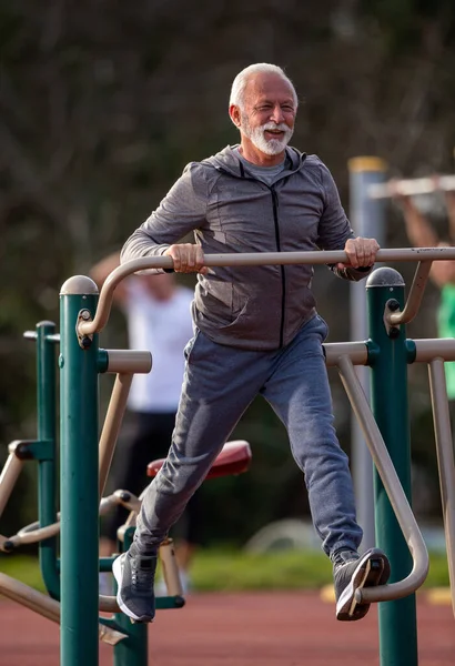 Senior Man Tracksuit Exercising Sky Stepper Public Gym Outdoor — Stock Photo, Image