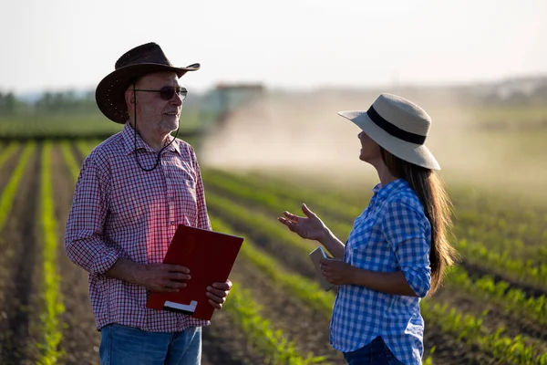 Two Farmers Young Woman Senior Man Talking Soybean Field Spring — Foto Stock