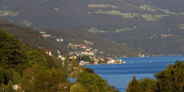 Landscape of Millstat city on Austrian lake Millstatter see in summer time, famous for spa resort and cycling ruts