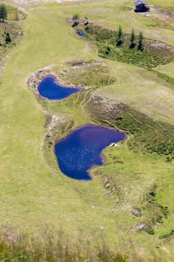 Beautiful landscape of two small lakes on top of mountain, on Goldeck peak, south Austrian Alps 