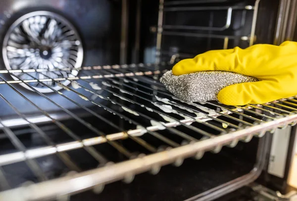 Close Hands Protective Gloves Cleaning Wire Oven — Stock Photo, Image