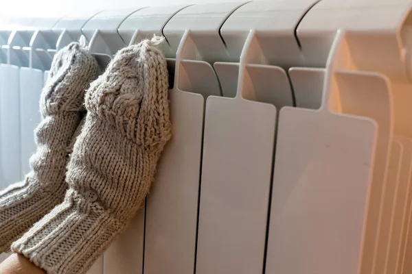 Close Female Hands Wool Mittens Warming Radiator Energy Efficiency Savings — Stock Photo, Image