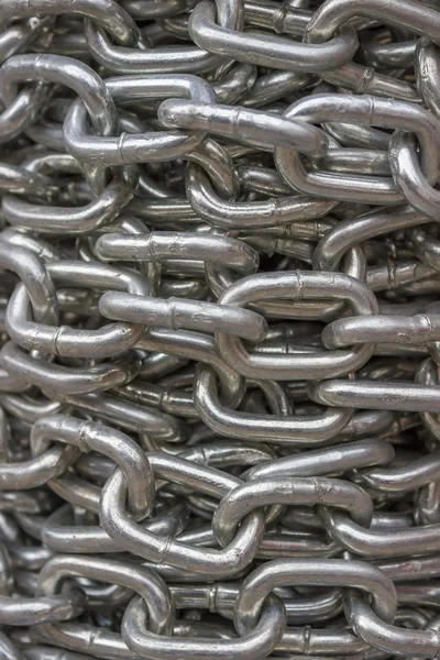 Coiled steel chain background — Stock Photo, Image