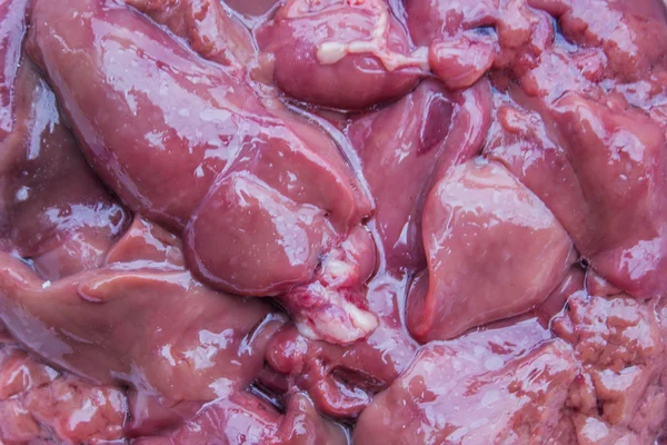 Fresh raw chicken liver background — Stock Photo, Image