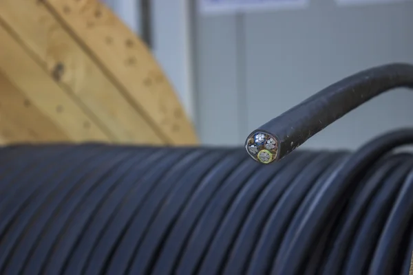 Roll of black industrial al cable with cross section 2 — Stock Photo, Image