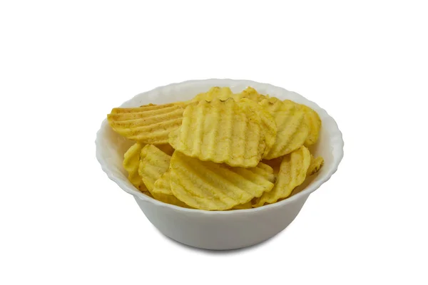 Ribbed yellow potato chips in bowl isolated on white background — Stock Photo, Image