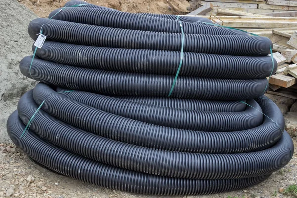 Roll of black flexible conduit nylon pipe — Stock Photo, Image