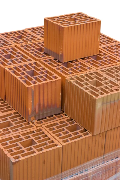 Bloc d'argile creux orange empilé pour la construction de bâtiments — Photo