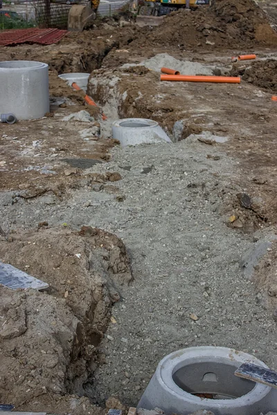 PVC pipes in ditch with piles of dirt around it — Stock Image PVC pipes in ditch with piles of dirt around it Stock Picture