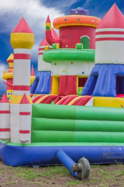 Jumping castle, playground for kids with slides clipart