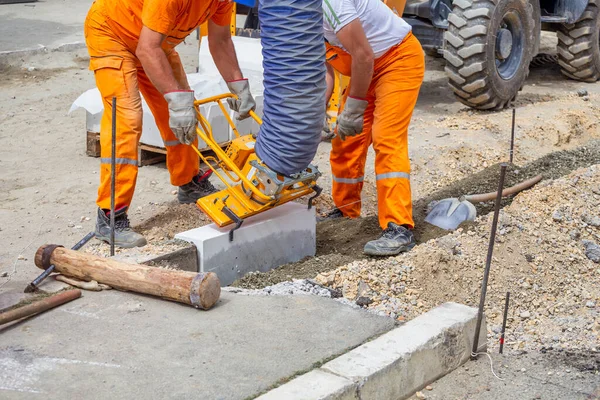 Workers Using Machine Align Set Concrete Curbs Concrete Kerb Installation — Stock Photo, Image