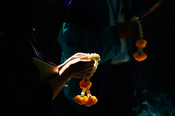 Hand holding garland for worship in thailand, Close up shot