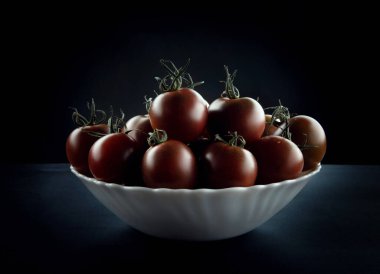 Ripe tomatoes in a plate. Cumato tomatoes.