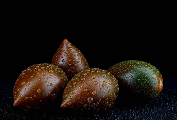 Several Ripe Cumato Tomatoes Drops Water Peel Black Background — Stock Photo, Image