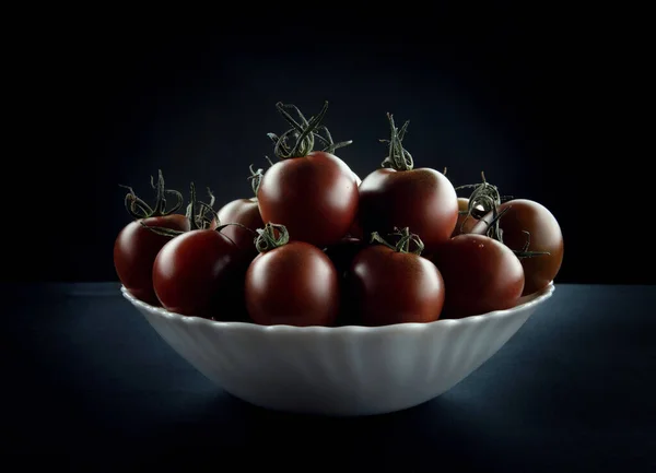 Ripe tomatoes in a plate. Cumato tomatoes.