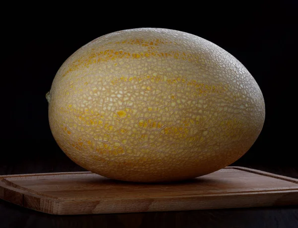 Yellow Ripe Melon Wooden Cutting Board Black Background — Fotografia de Stock