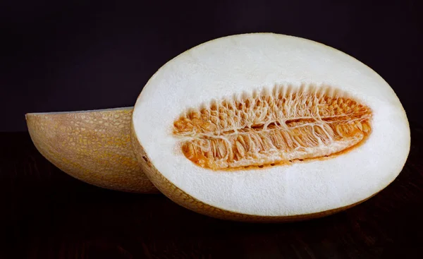 Ripe Melon Cut Half Seeds Black Background — Stok fotoğraf