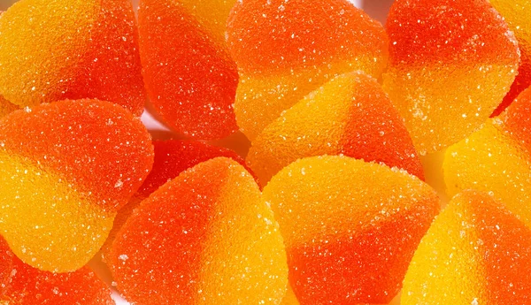 Background of many marmalade hearts. Heart-shaped candy.