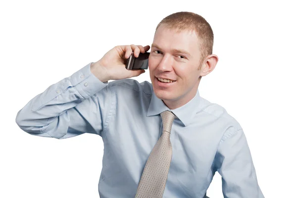 A young man on a white background with a cell phone Royalty Free Stock Photos