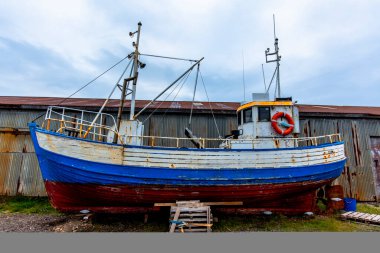 wooden fishing boat in storage in the plains at the end of the fjord at Borgarfiordur Eystri in Iceland