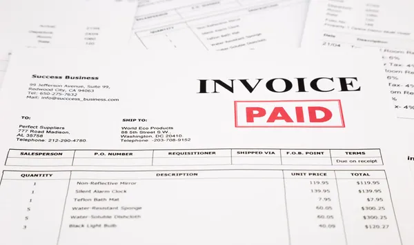 Invoice and bills with paid stamp — Stock Photo, Image