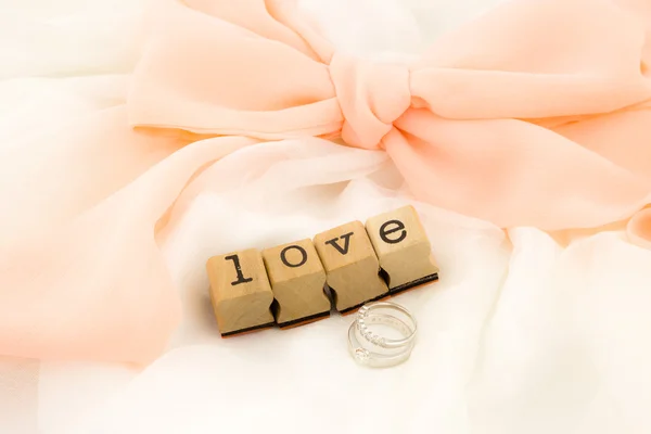 Love wording and rings on beautiful dress — Stock Photo, Image
