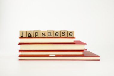 japanese language word on wood stamps and books clipart