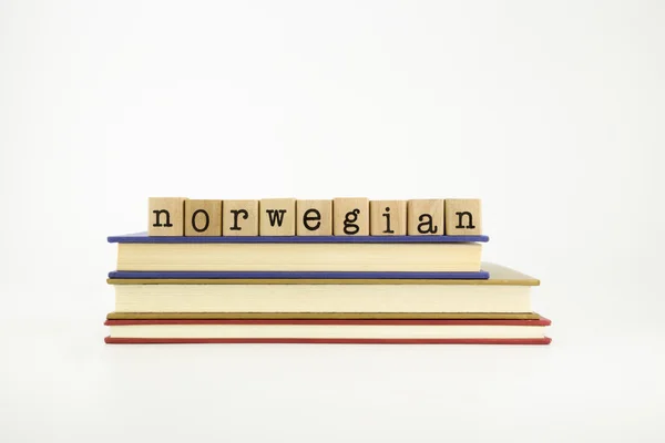 Norwegain language word on wood stamps and books — Stock Photo, Image