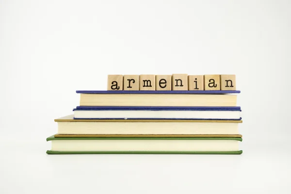 Armenian language word on wood stamps and books — Stock Photo, Image