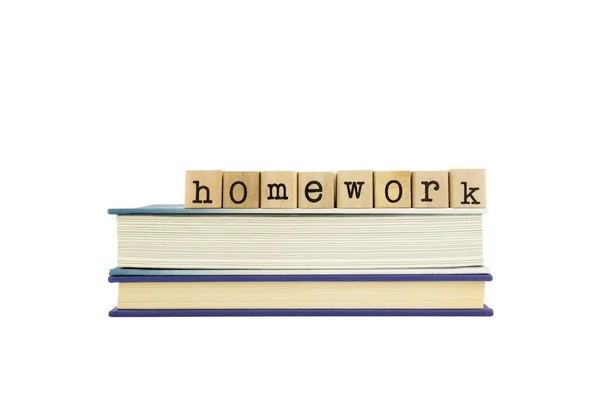 Homework word on wood stamps and books — Stock Photo, Image