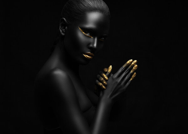 beauty portrait of a beautiful black woman with gold elements.
