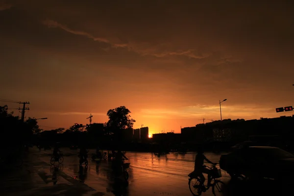 Silhouette of on orange sunset's background — Stock Photo, Image