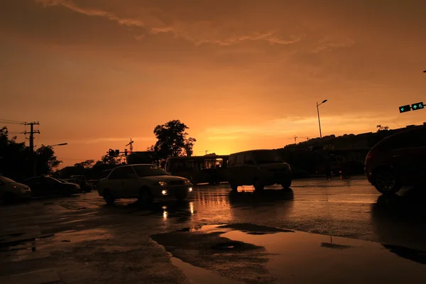 Silhouette of on orange sunset's background — Stock Photo, Image