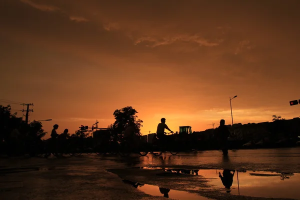 Silhouette of on orange sunset's background — Stock Photo, Image