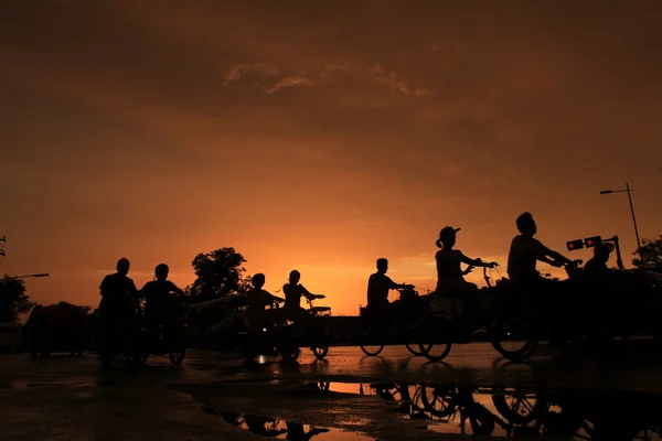 Silhouette of on orange sunset's background — Stock Photo, Image