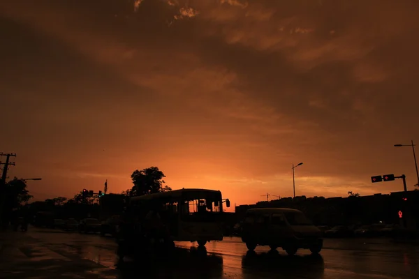 Silhouette of on orange sunset's background — Stock Photo, Image